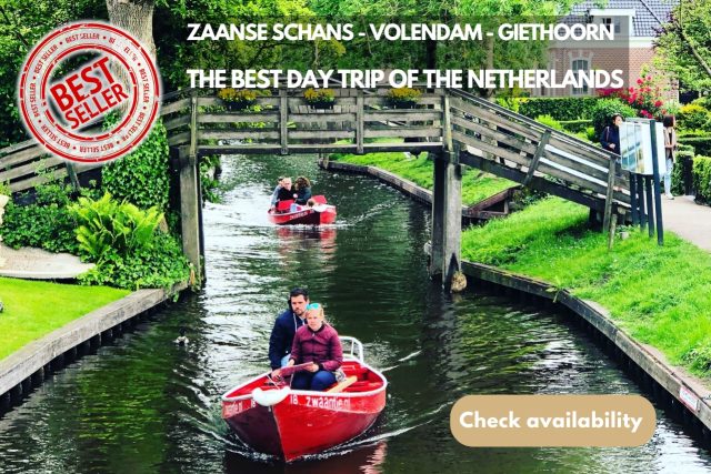 A Group Of People In A Boat On A Canal Of Giethoorn