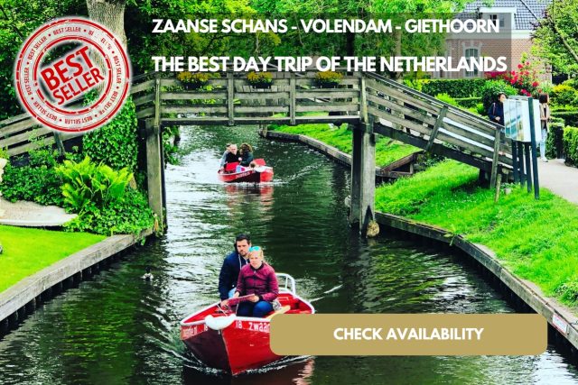 A Group Of People In A Boat On A Canal Of Giethoorn