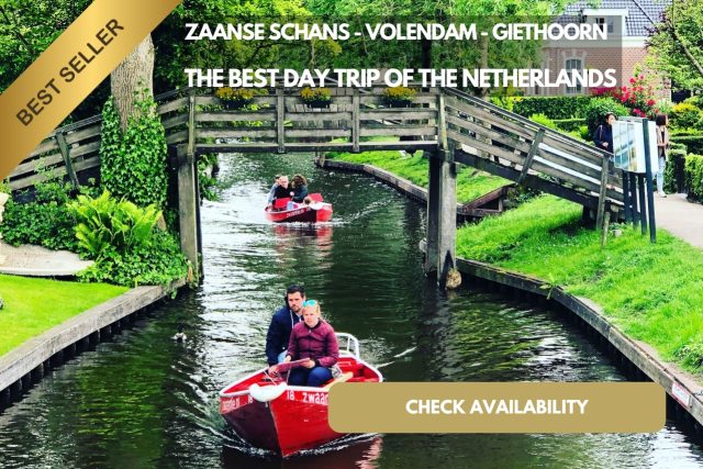 A Group Of People In A Boat On A Canal Of Giethoorn